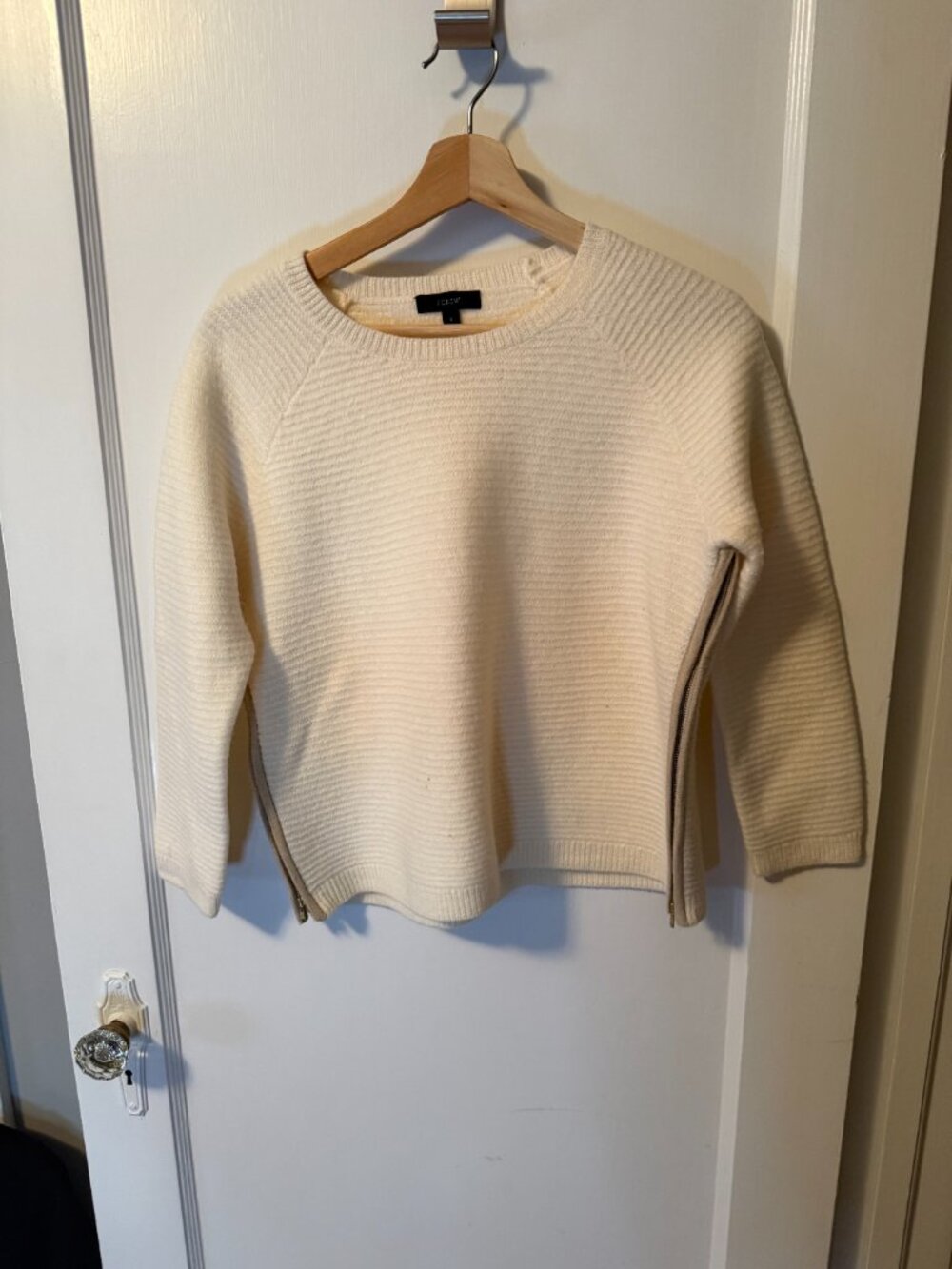 J Crew oatmeal boiled wool cropped sweater with side-seam zippers.